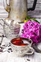 Stylish metal cup of tea