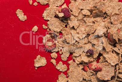 Muesli on a red plate