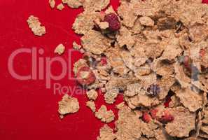 Muesli on a red plate