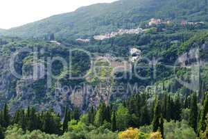 The view on mountains, cypress and olive trees in Corfu island,