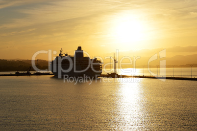 The cruise ship during sunset in Kerkyra port, Corfu island, Gre