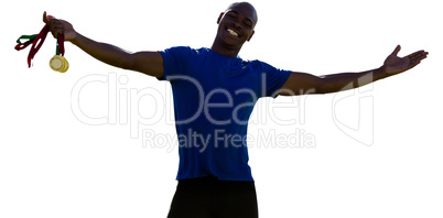 Happy sportsman smiling and holding medals