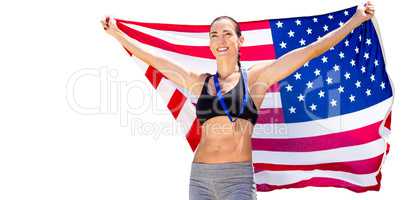 Happy sportswoman posing with an american flag