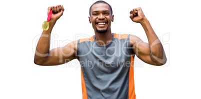 Happy sportsman smiling and holding medals