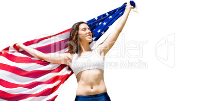 Happy sportswoman posing with an american flag