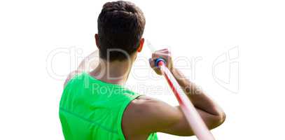 Rear view of sportsman practising javelin throw