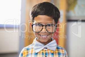 Portrait of smiling schoolboy in spectacle