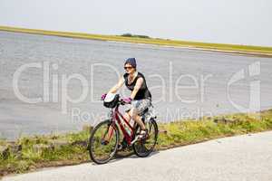 Woman take a vacation bike seaside