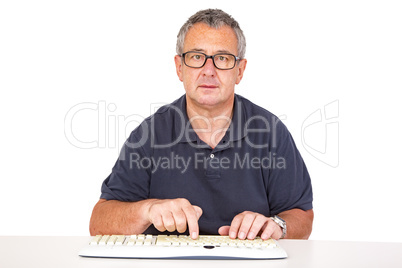 Man sitting at the computer keyboard