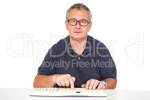 Man sitting at the computer keyboard