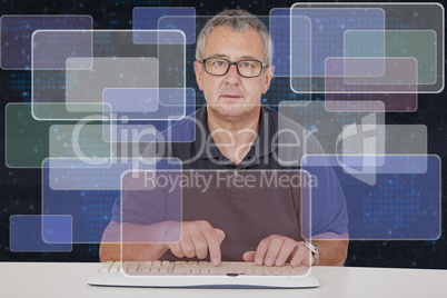 Man sitting at the computer keyboard in front Digital Wall