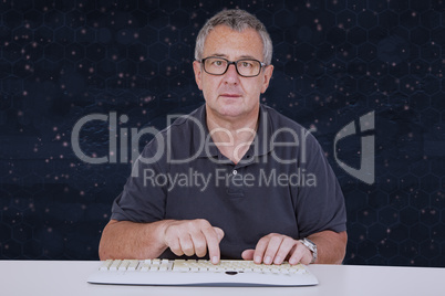 Man sitting at the computer keyboard in front Digital Wall