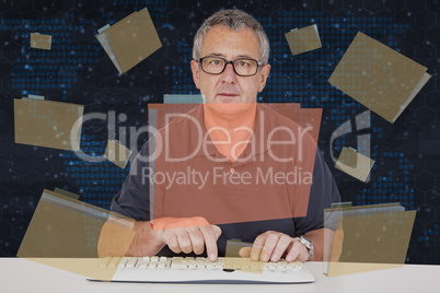 Man sitting at the computer keyboard in front Digital Wall