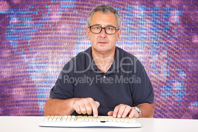 Man sitting at the computer keyboard in front Digital Wall