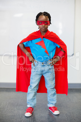 Portrait of boy pretending to be a superhero