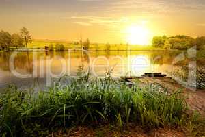 Yellow sunset on pond
