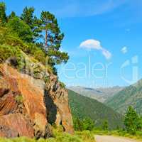 Scenic mountain landscape with cliff and pines
