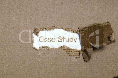 The word case study appearing behind torn paper.