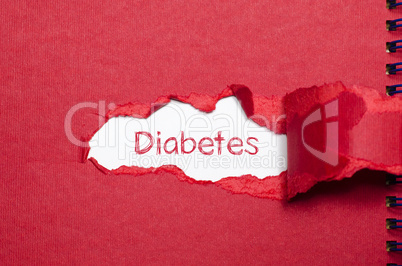 The word diabetes appearing behind torn paper.