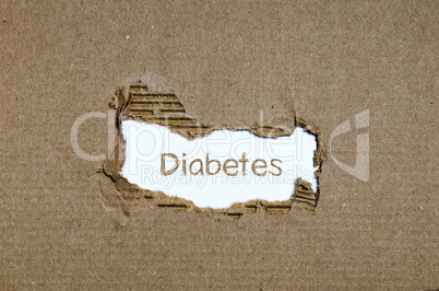 The word diabetes appearing behind torn paper.