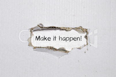 The word make it happen appearing behind torn paper.