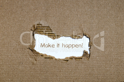 The word make it happen appearing behind torn paper.