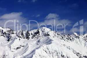 View on snowy mountains in sunny day