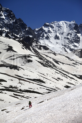 Hiker in snowy mountains