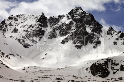 Snowy rocks with traces from avalanches