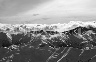 Black and white evening snowy mountains
