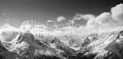 Black and white panorama of sunlight mountains in cloud
