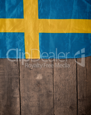 Swedish flag on wood