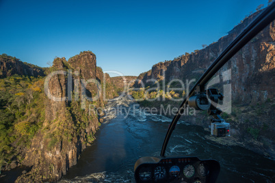 Aerial view from helicopter of sunlit gorge