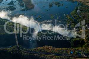 Aerial view of Victoria Falls behind road