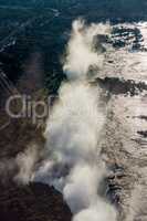 Aerial view of Victoria Falls creating spray