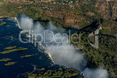Aerial view of bridge beside Victoria Falls