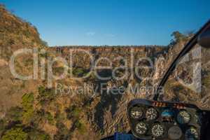 Aerial view of sunlit col in canyon