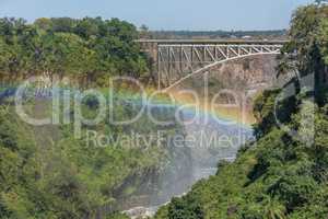 Close-up of Victoria Falls Bridge over rainbow