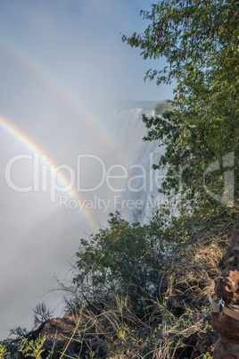 Double rainbow in Victoria Falls spray clouds