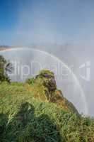 Double rainbow in spray over Victoria Falls