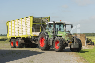 transport of cut grass with tractor and loader wagon