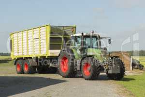 transport of cut grass with tractor and loader wagon