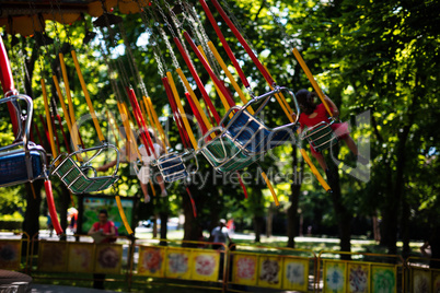 Swing seat carousel at amusement ride