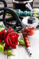 Hookah and red rose