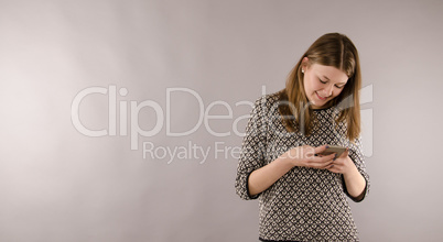 Happy female teenager with a mobile phone