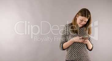Happy female teenager with a mobile phone