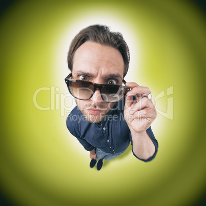 Funny man looking through his sunglasses