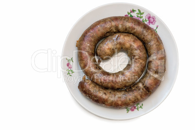 Fried pork sausage are homemade on a white background.