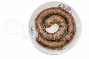 Fried pork sausage are homemade on a white background.