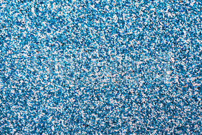 Horizontal vivid blue pebble grainy sand textured abstract backg